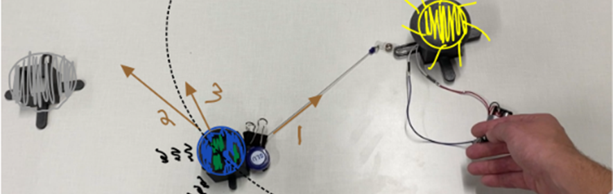 Sketches of planets and force vectors overlayed onto moveable haptic modules that enable sensing these relations.